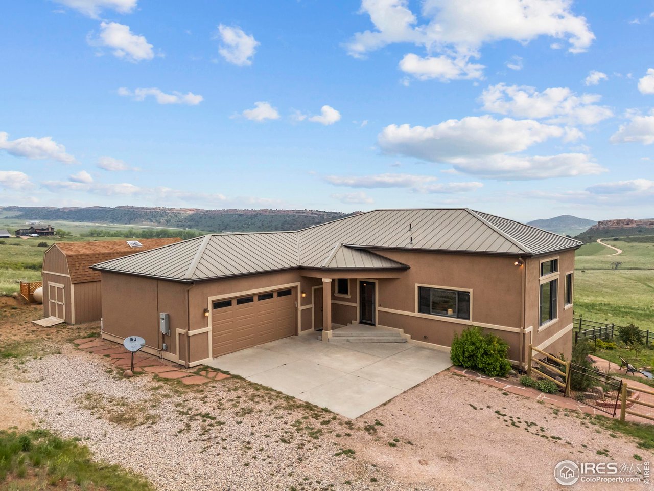 183 Red Bear Road Laporte, CO 80535 - Photo 1 of 32 a front view of a house with a yard