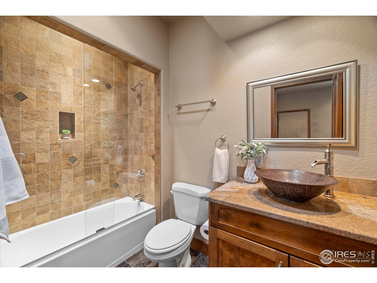 183 Red Bear Road Laporte, CO 80535 - Photo 13 of 32 a bathroom with a toilet a sink and a bathtub