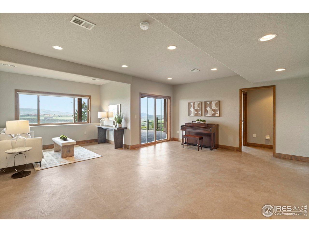 183 Red Bear Road Laporte, CO 80535 - Photo 16 of 32 a living room with furniture and a large window