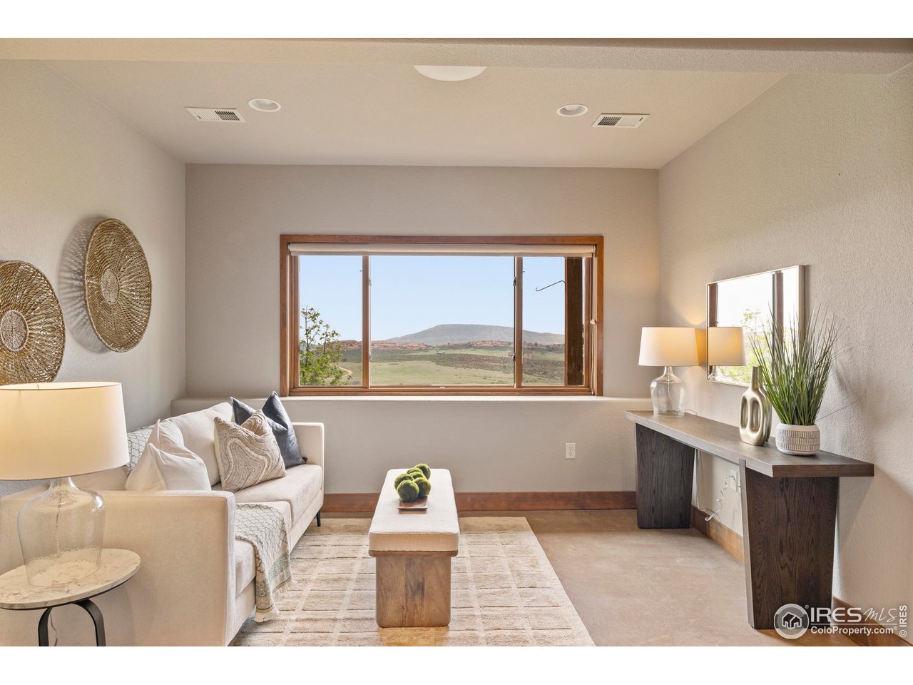 183 Red Bear Road Laporte, CO 80535 - Photo 17 of 32 a living room with furniture and a large window