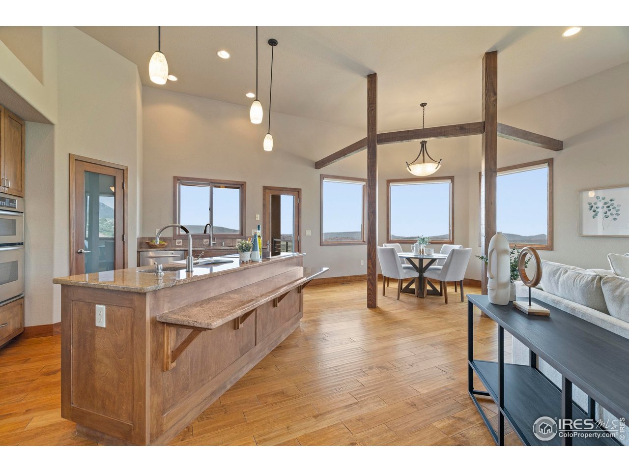183 Red Bear Road Laporte, CO 80535 - Photo 23 of 32 a living room with lots of furniture and a large window