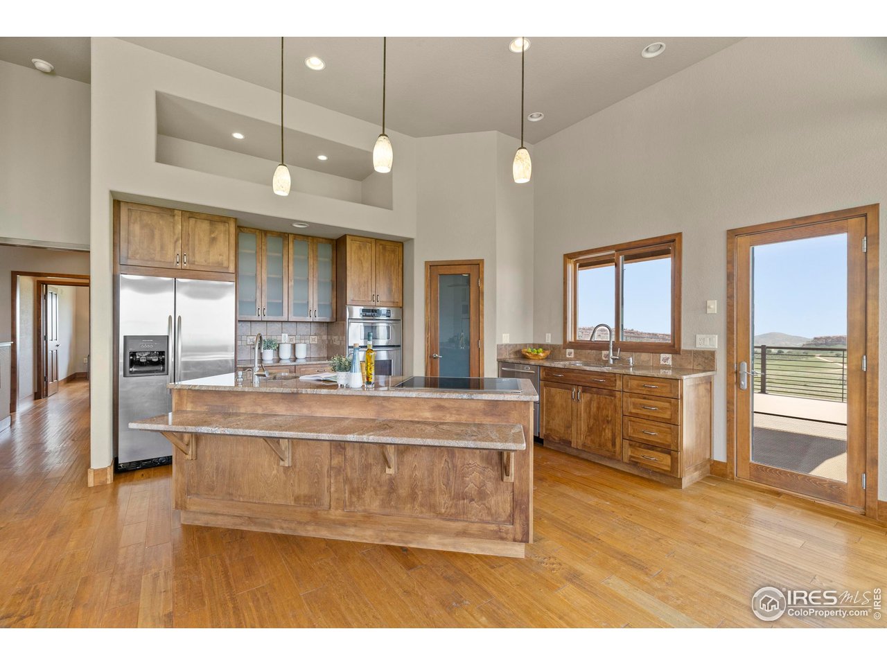 183 Red Bear Road Laporte, CO 80535 - Photo 5 of 32 a view of living room and kitchen with wooden floor
