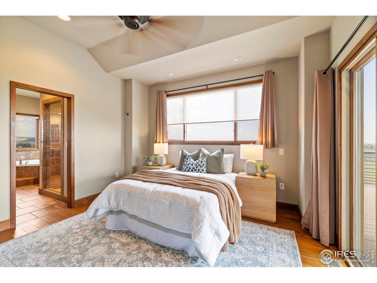 183 Red Bear Road Laporte, CO 80535 - Photo 10 of 32 a bedroom with a bed next to a window