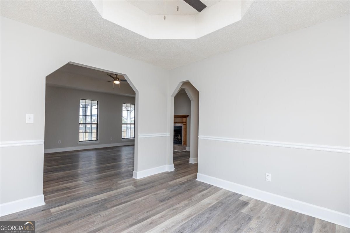1027 Kathryn Ryals Road Warner Robins, GA 31088 - Photo 14 of 54 an empty room with wooden floor and windows