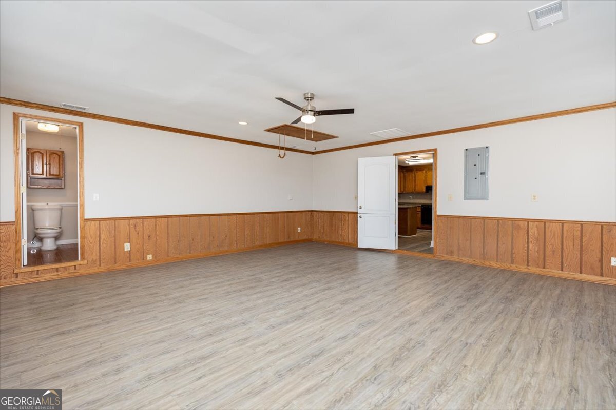 1027 Kathryn Ryals Road Warner Robins, GA 31088 - Photo 27 of 54 wooden floor in an empty room with a window