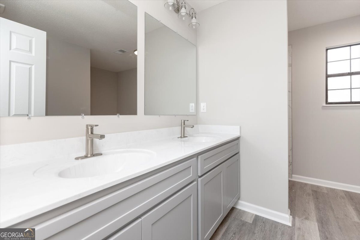 1027 Kathryn Ryals Road Warner Robins, GA 31088 - Photo 32 of 54 a bathroom with a sink and a mirror