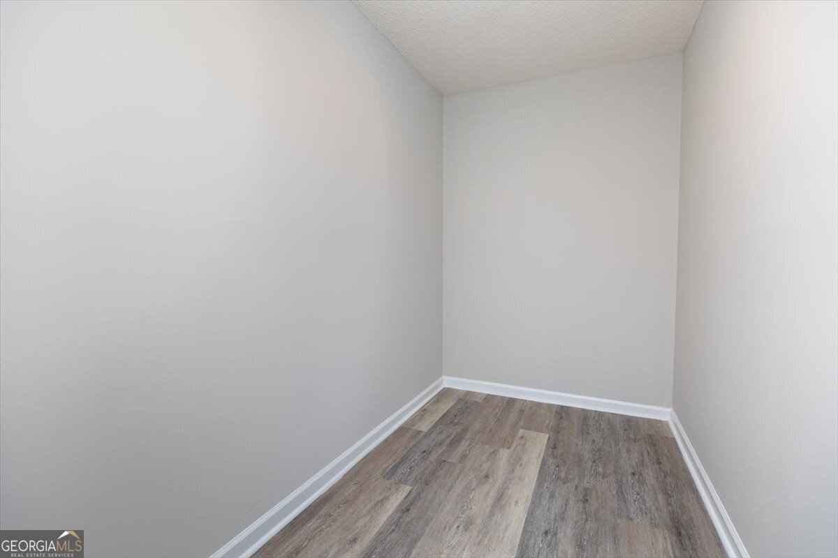 1027 Kathryn Ryals Road Warner Robins, GA 31088 - Photo 36 of 54 a view of a small space with wooden floor and a window