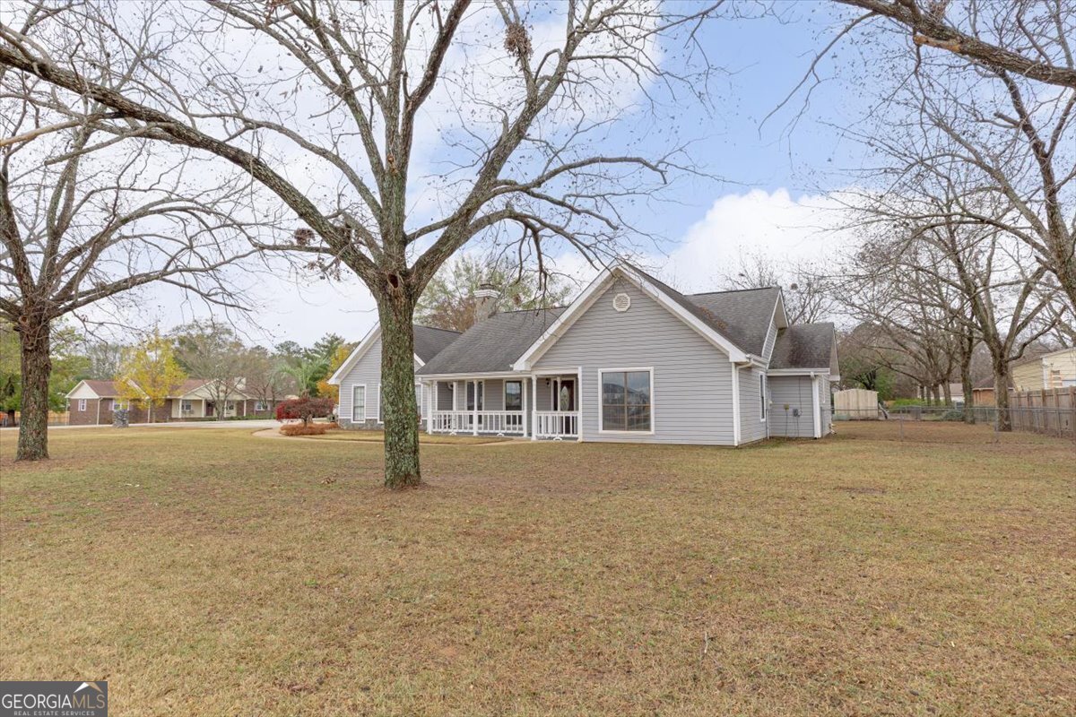 1027 Kathryn Ryals Road Warner Robins, GA 31088 - Photo 4 of 54 a house with trees in front of it