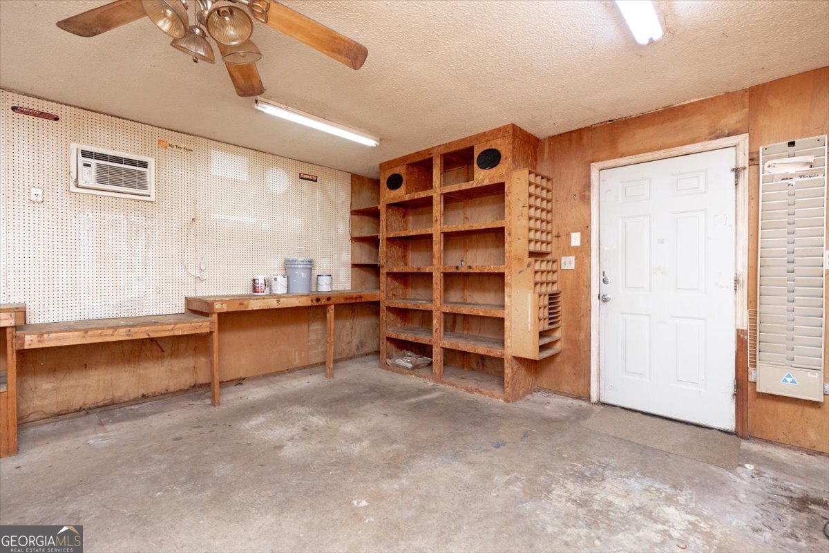 1027 Kathryn Ryals Road Warner Robins, GA 31088 - Photo 45 of 54 a view of an empty room with a cabinet and a window