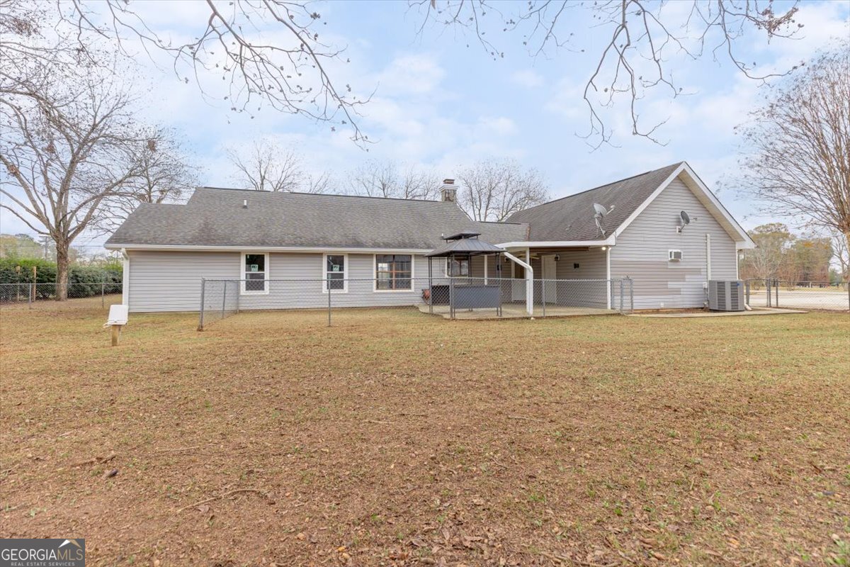 1027 Kathryn Ryals Road Warner Robins, GA 31088 - Photo 49 of 54 a front view of a house with a yard