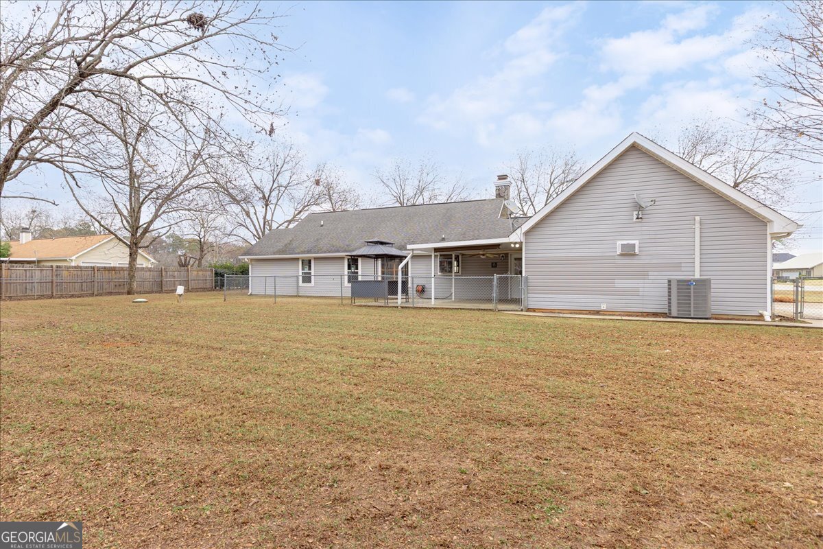 1027 Kathryn Ryals Road Warner Robins, GA 31088 - Photo 50 of 54 a front view of house with yard and trees around