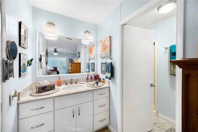 a bathroom with a sink double vanity and a mirror