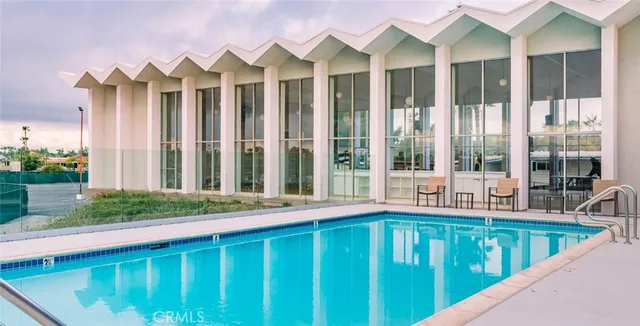 a view of a house with a porch and furniture