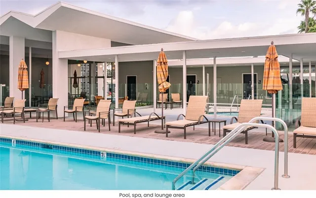 a building outdoor space with patio furniture and potted plants