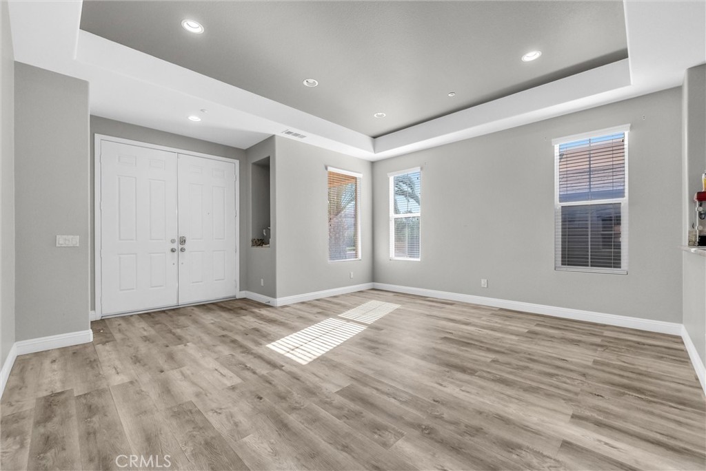 18388 Hidden Ranch Road Riverside, CA 92508 - Photo 18 of 46 wooden floor in an empty room with window