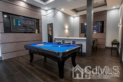 4304 Pine Valley Way Piscataway, NJ 08854 - Photo 11 of 26 a view of a room with furniture and wooden floor
