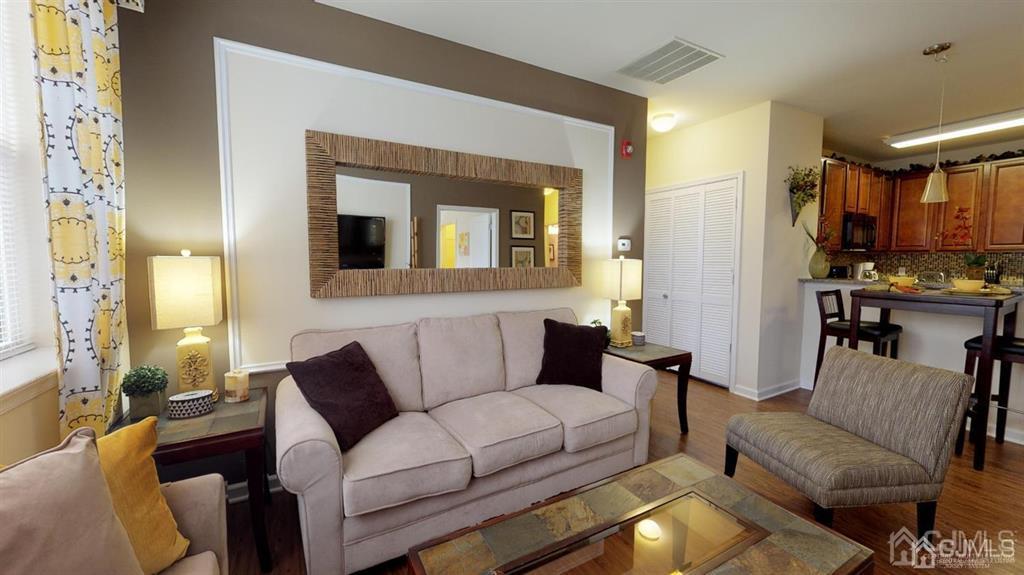 4304 Pine Valley Way Piscataway, NJ 08854 - Photo 18 of 26 a living room with furniture and a fireplace