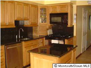 175 Friendship Road Howell, NJ 07731 - Photo 2 of 3 a kitchen with a sink and a stove top oven