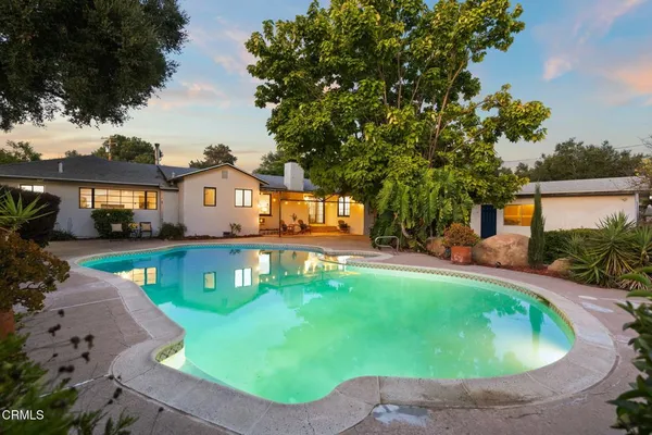 a house view with a swimming pool