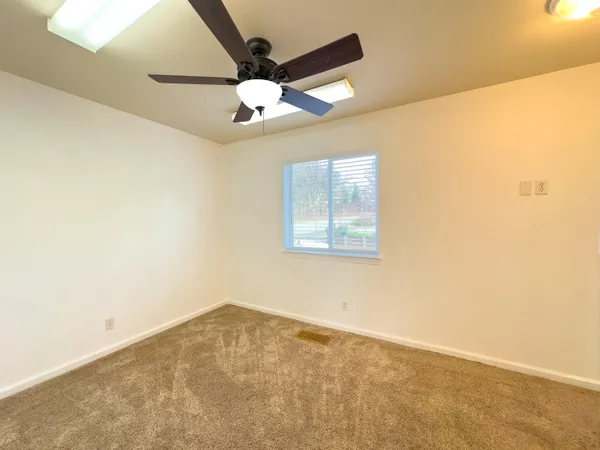 a bedroom with a bed and a cabinets