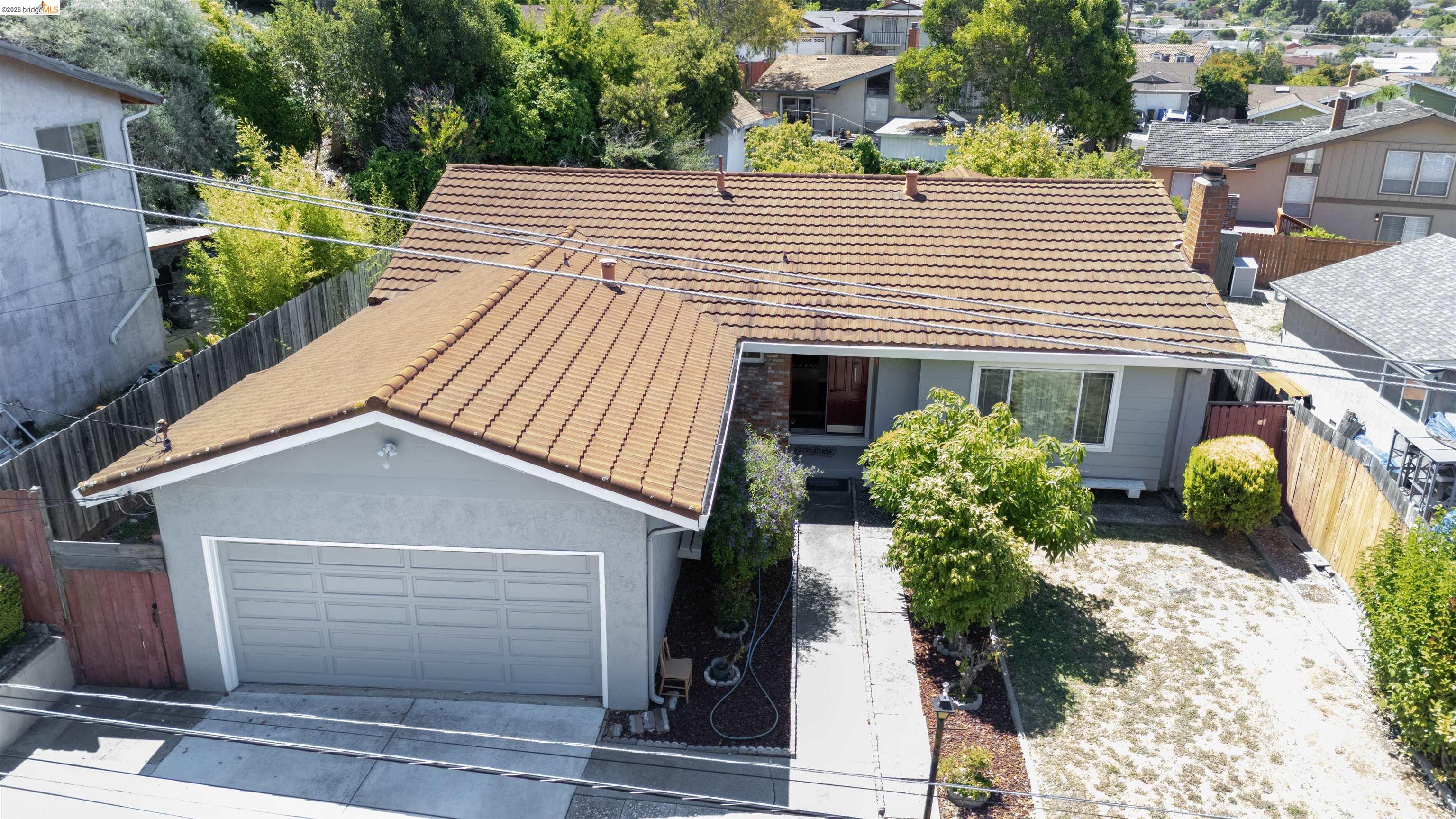 767 Marlesta Road Pinole, CA 94564 - Photo 1 of 16 Ranch-style residence featuring a tile roof and light gray stucco exterior