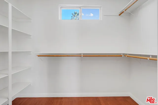 a living room with furniture dining area and a view of kitchen