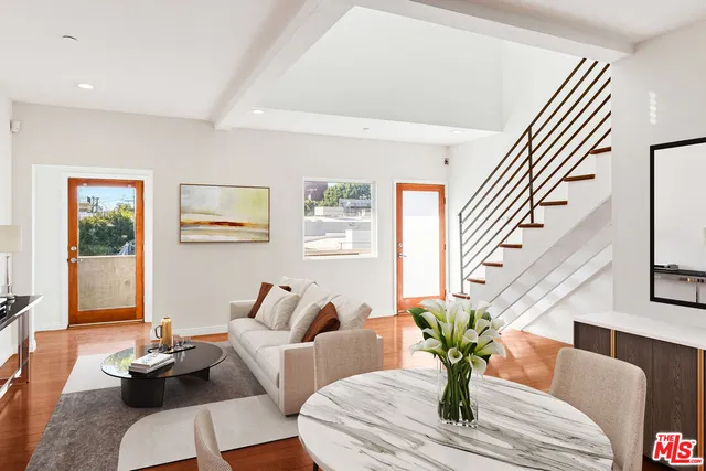 a kitchen with stainless steel appliances a stove a sink and a refrigerator