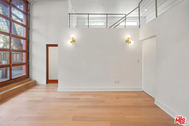 a living room with furniture a bathtub and a shower