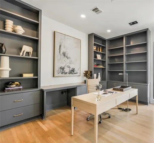 a living room with furniture large window and a fireplace