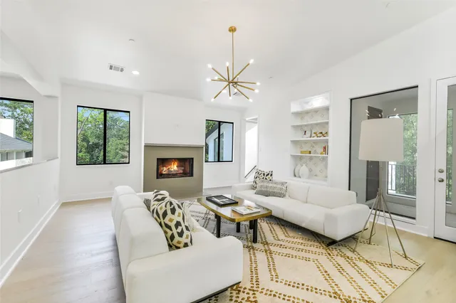 a bedroom with a large bed and a book shelf
