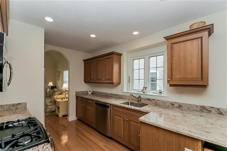 80 Brookside Road, Unit 205 Bourne, MA 02532 - Photo 15 of 35 a kitchen with a sink stove top oven and cabinets