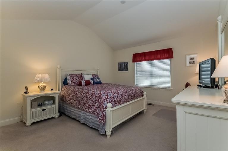 80 Brookside Road, Unit 205 Bourne, MA 02532 - Photo 17 of 35 a bedroom with a bed and a kitchen sink