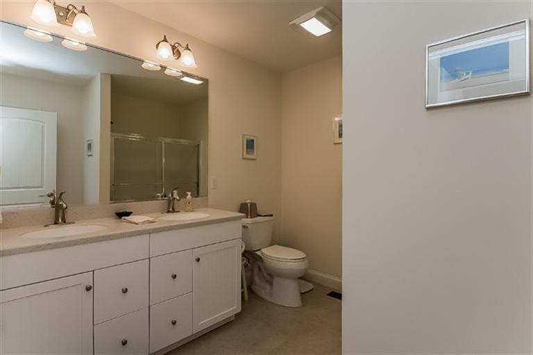 80 Brookside Road, Unit 205 Bourne, MA 02532 - Photo 19 of 35 a spacious bathroom with a double vanity sink toilet and mirror