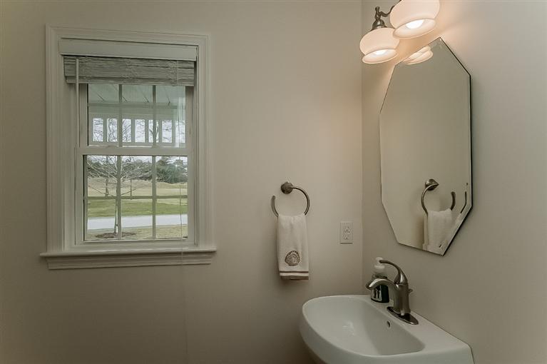 80 Brookside Road, Unit 205 Bourne, MA 02532 - Photo 20 of 35 a bathroom with a sink and mirror with window
