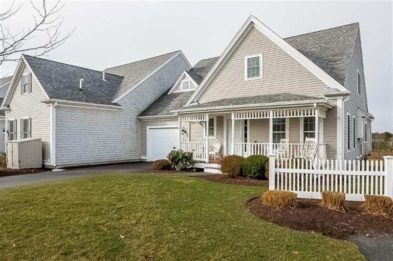 80 Brookside Road, Unit 205 Bourne, MA 02532 - Photo 2 of 35 a front view of a house with garden