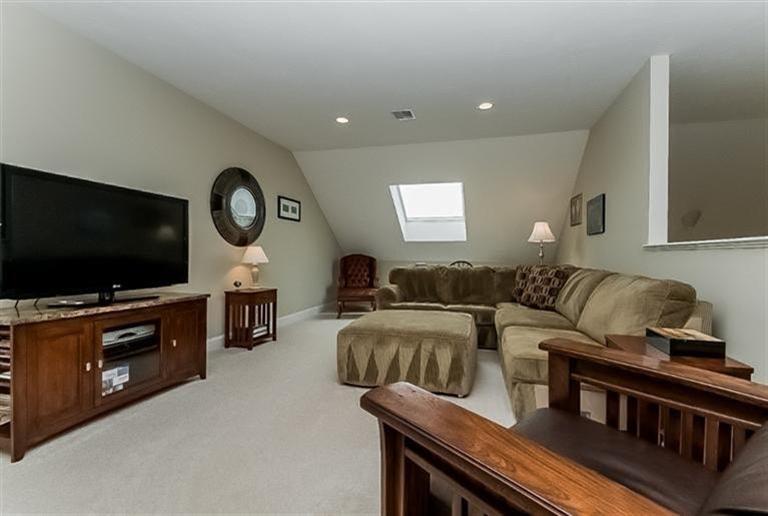 80 Brookside Road, Unit 205 Bourne, MA 02532 - Photo 21 of 35 a living room with furniture and a flat screen tv