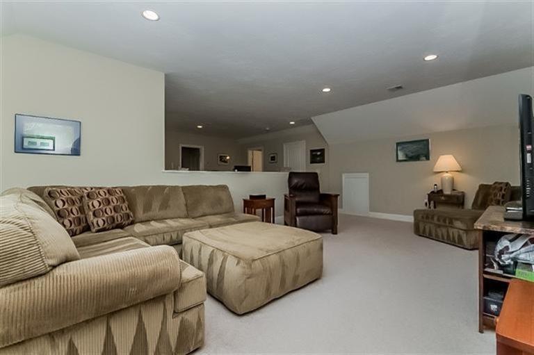 80 Brookside Road, Unit 205 Bourne, MA 02532 - Photo 22 of 35 a living room with furniture and a flat screen tv