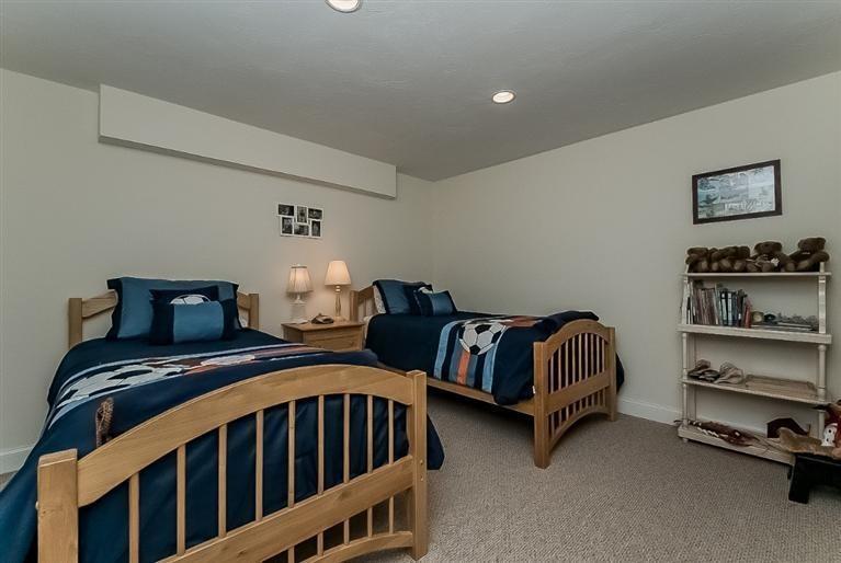 80 Brookside Road, Unit 205 Bourne, MA 02532 - Photo 28 of 35 a bedroom with two beds and lamp