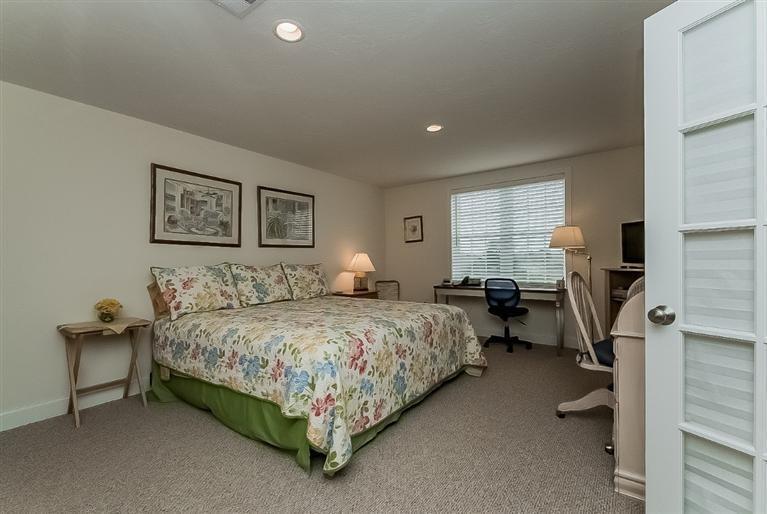 80 Brookside Road, Unit 205 Bourne, MA 02532 - Photo 29 of 35 a bedroom with a bed and furniture