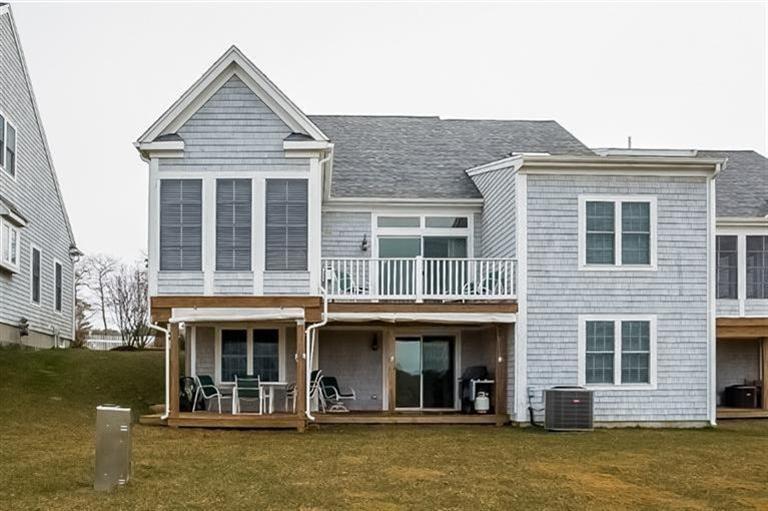 80 Brookside Road, Unit 205 Bourne, MA 02532 - Photo 32 of 35 a front view of a house with swimming pool