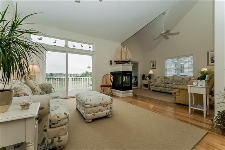 80 Brookside Road, Unit 205 Bourne, MA 02532 - Photo 4 of 35 a living room with furniture and a large window