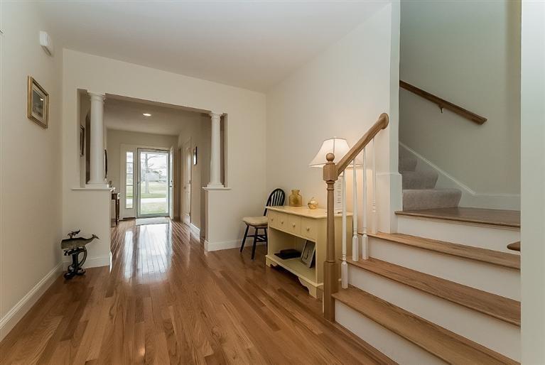 80 Brookside Road, Unit 205 Bourne, MA 02532 - Photo 7 of 35 a view of a hallway with wooden floor and staircase