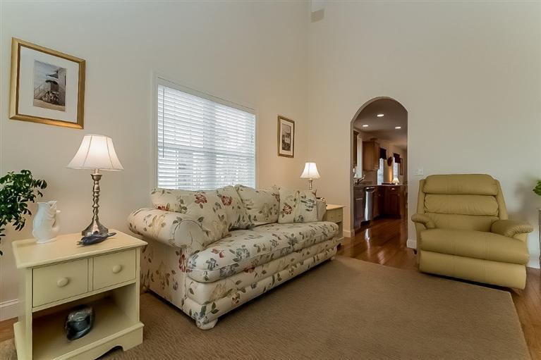 80 Brookside Road, Unit 205 Bourne, MA 02532 - Photo 10 of 35 a living room with furniture and a window