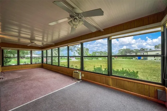 a view of a house with backyard and porch