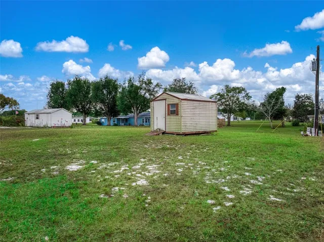 a view of a backyard of the house
