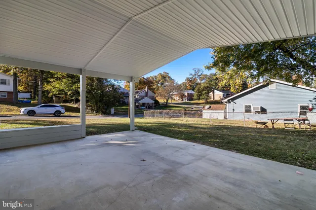 a kitchen with a sink cabinets and wooden floor