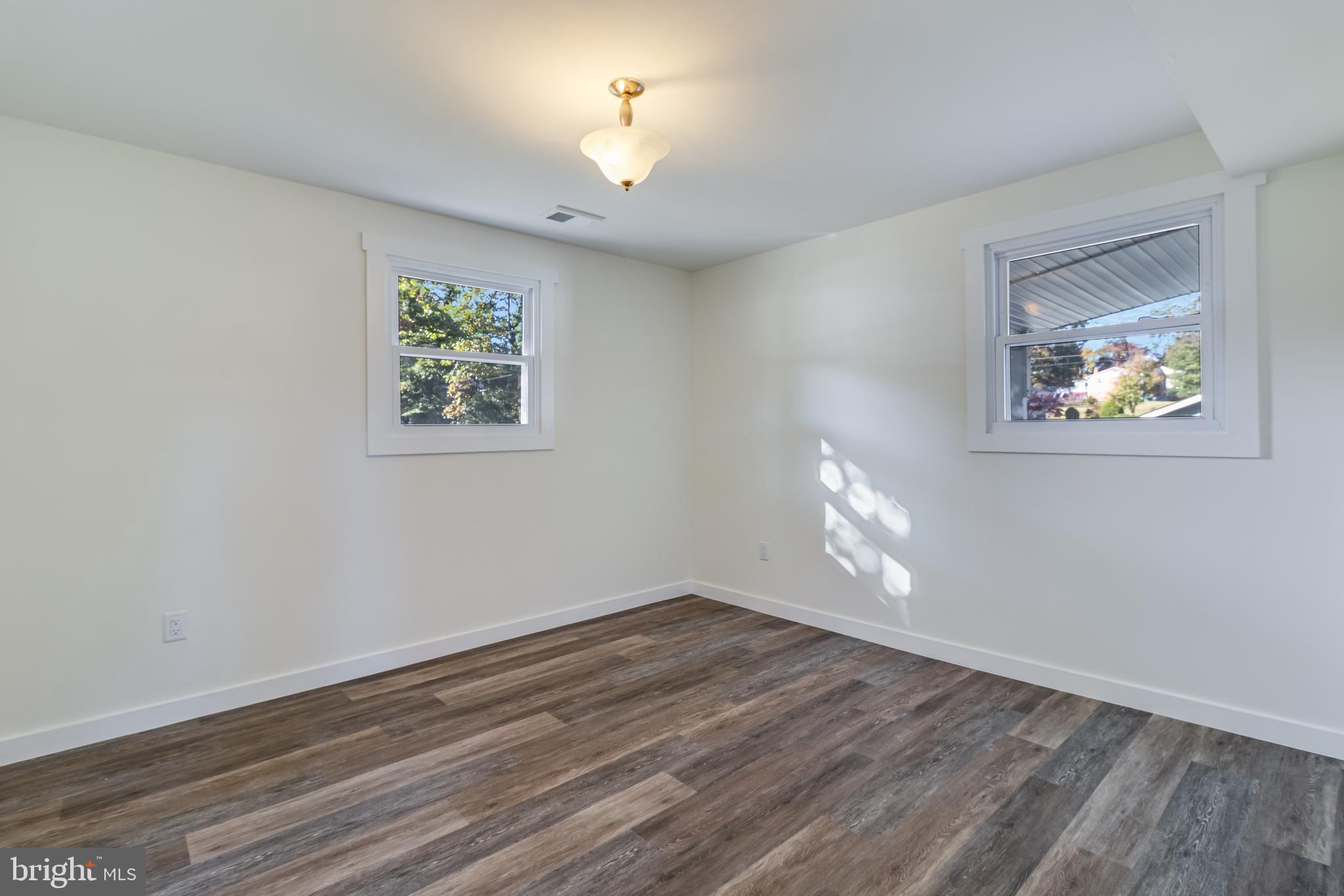 2804 Testway Avenue Fort Washington, MD 20744 - Photo 16 of 36 a view of an empty room with wooden floor and a window
