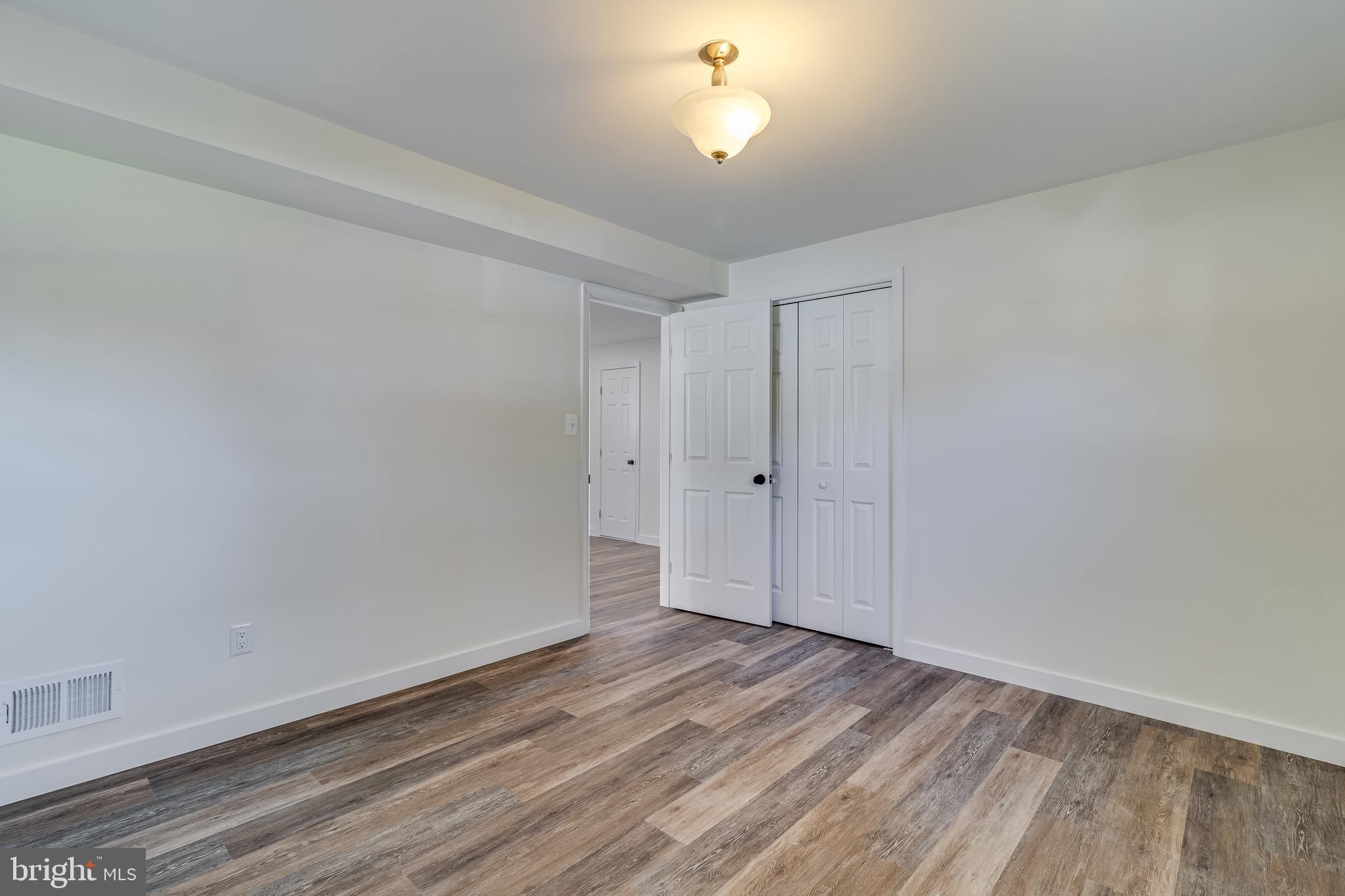 2804 Testway Avenue Fort Washington, MD 20744 - Photo 17 of 36 a view of room with hardwood floor and a ceiling fan