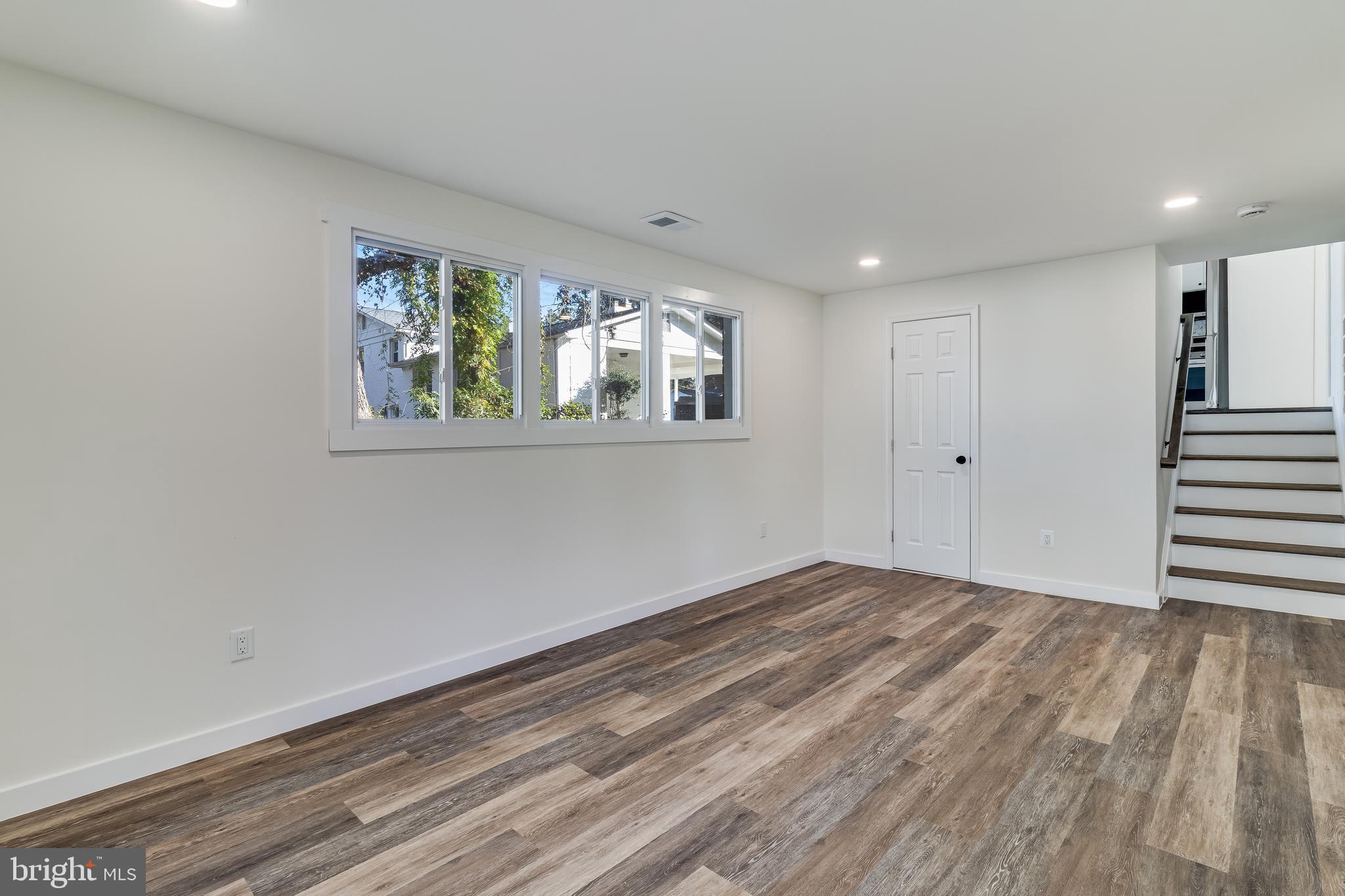 2804 Testway Avenue Fort Washington, MD 20744 - Photo 19 of 36 a view of an empty room with wooden floor and a window