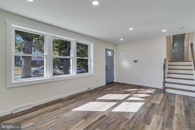 a view of entryway with wooden floor